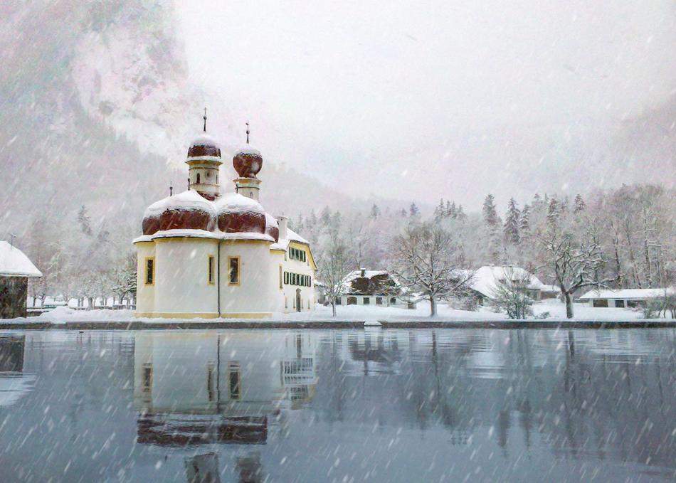church by the lake in the snow