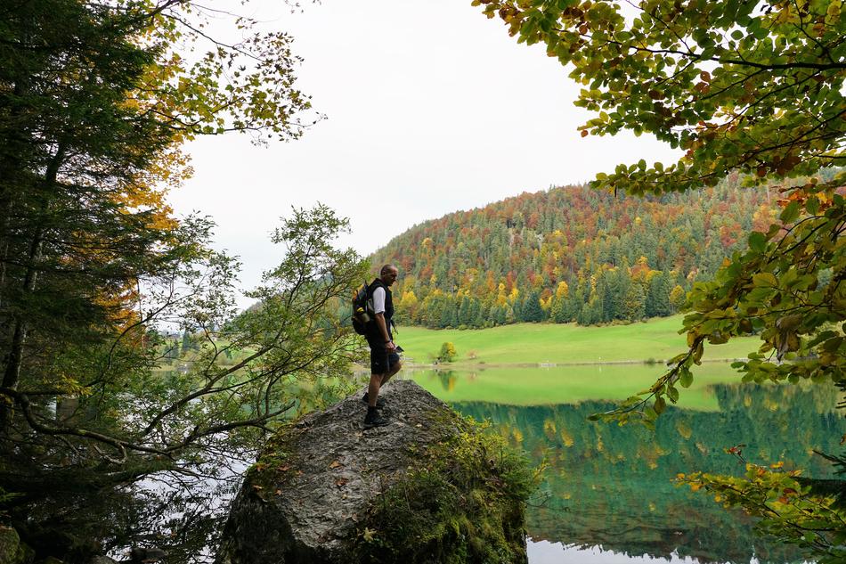 man on a rock by the lake