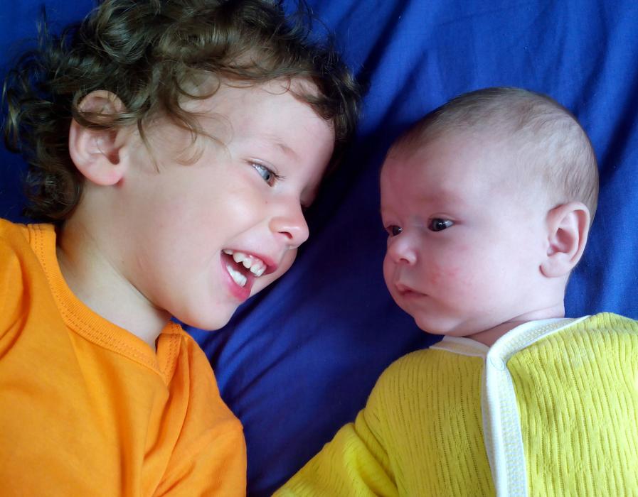 cute babies on a blue sheet