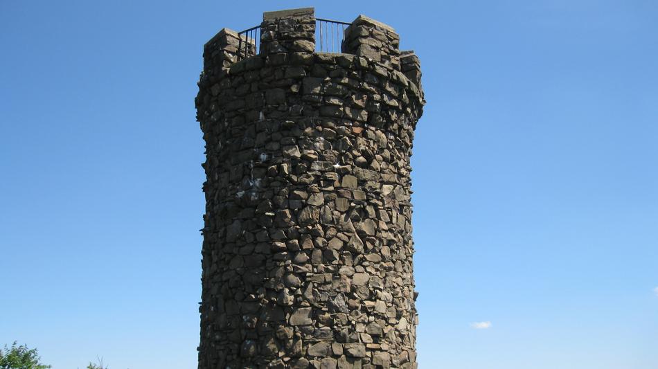 a big tower with a blue sky