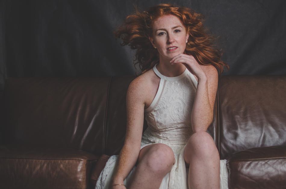 Portrait of pretty girl sitting on the couch