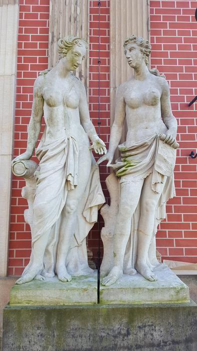 White statues of men made of stone