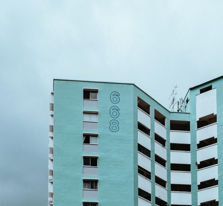 Building with numbers, under the sky with clouds