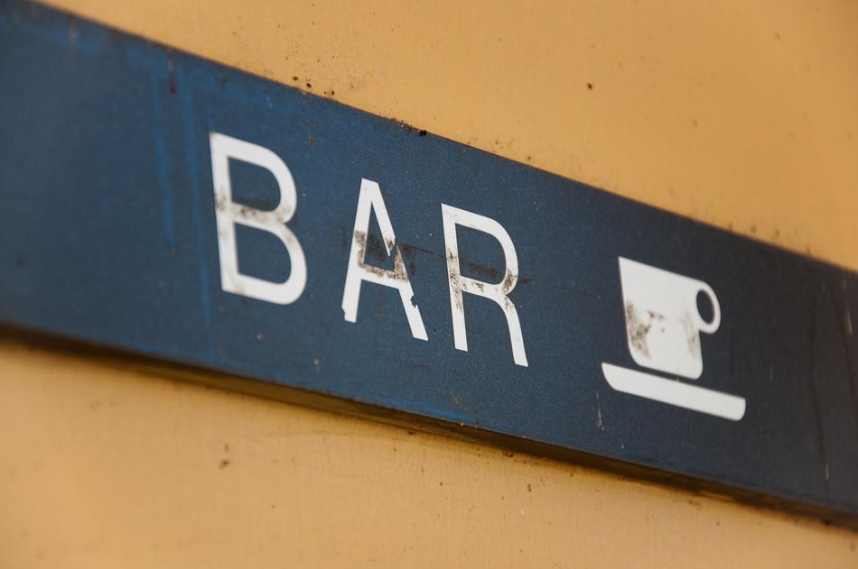 sign on the wall of the bar