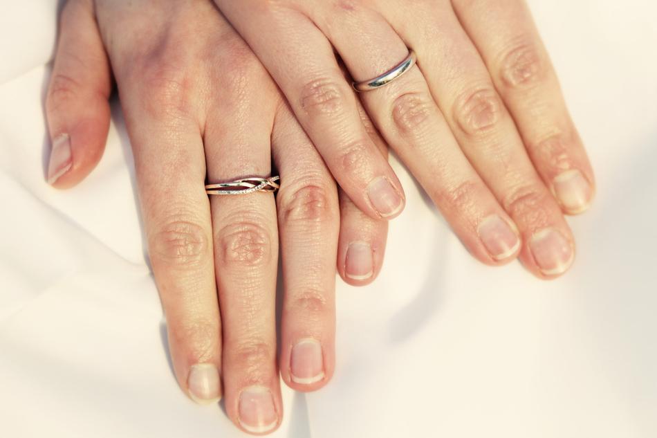 the hands of a man with a ring view