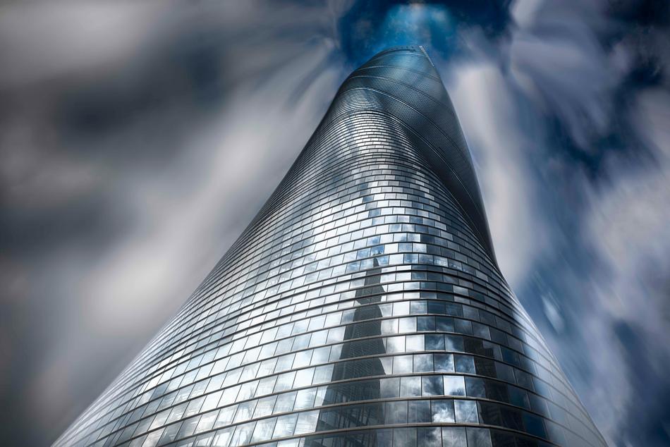 Low angle shot of the shiny building with reflections, under the sky with clouds, clipart