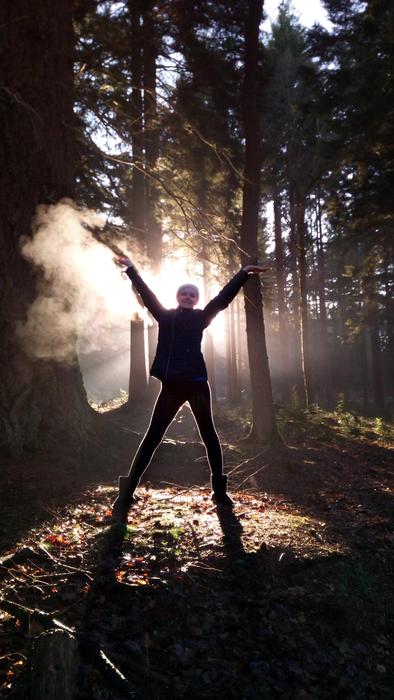 Person, among the beautiful trees in sunlight