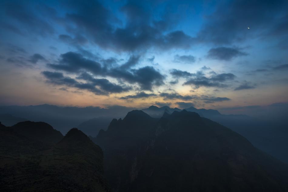a black rock in the clouds