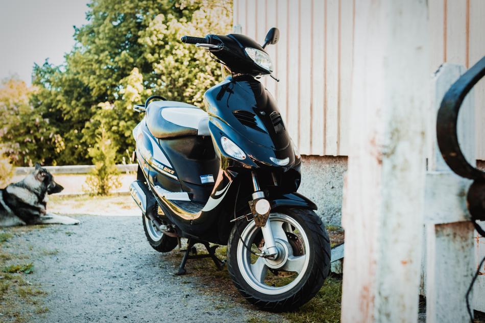 a black motorcycle against the wall