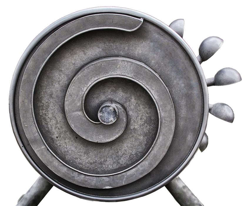 Close-up of the grey waterwheel, with the swirl pattern, at white background