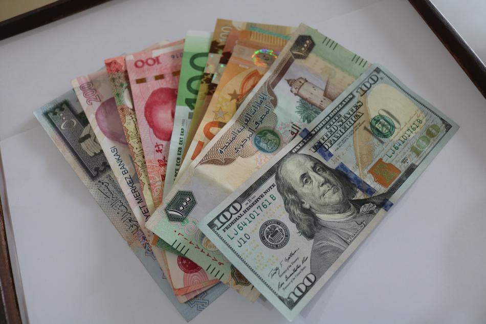 multicolored fan of financial banknotes