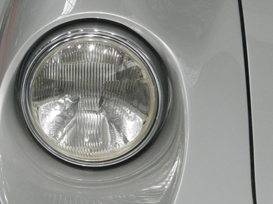 headlight on a gray car close-up