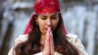 Beautiful oriental Woman praying