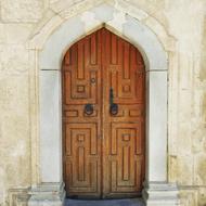 Beautiful, old, wooden door in the building on Crete in Greece