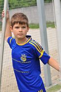 boy in blue at the football goal