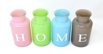 Shiny, green vases with "HOME" sign, at white background