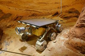 Shiny probe, on the colorful rocks, in light