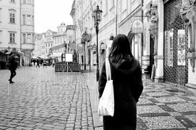 girl on the street of the old city in black and white background