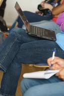 student taking notes in a notebook