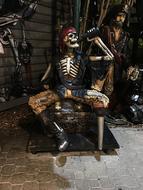 statue of a drinking pirate skeleton