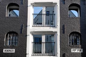 facade of a dark brick building in Amsterdam, the Netherlands