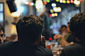 silhouette of people in a bar