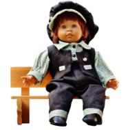 baby girl sits on bench, Doll