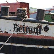 Old boat with sign, in Berlin, Germany