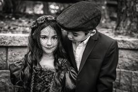 children in suits on black and white blurred background