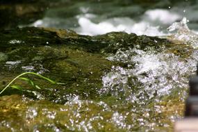 water splashing on stone
