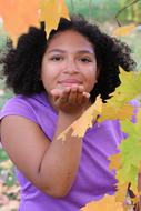 african Teen Girl and autumn leaves