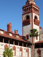 brown and white tower of historic building