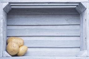 raw potatoes in a box