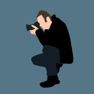 painted photographer squatting