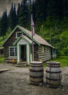 photo of barrels and a wooden abandoned school in Canada