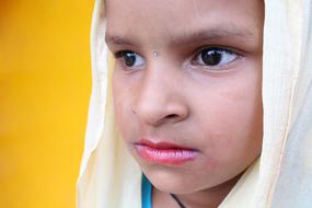 photo of an indonesian girl with a white scarf on her head
