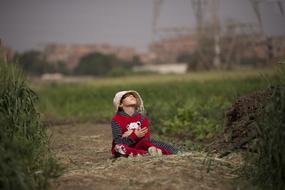 child outdoors on blurred background