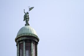 Beautiful architecture with statue, in Venice, Italy, under the blue sky