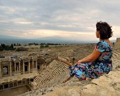 Woman Sitting Amphitheater