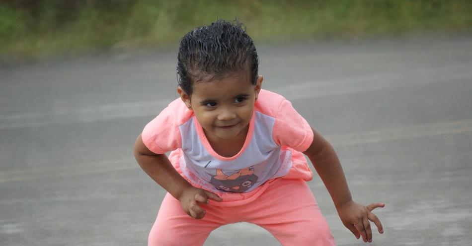 photo of smiling child in pink tshirt
