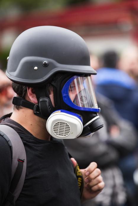 Man in the gas mask, and with the backpack, at blurred background, in Ä°stanbul, Turkey