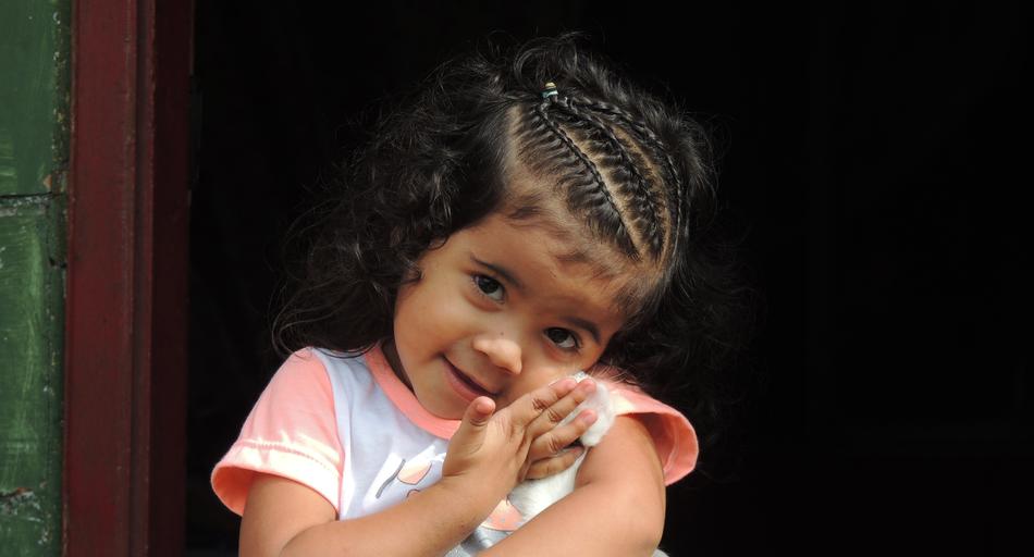 little cute girl with unusual hairstyle