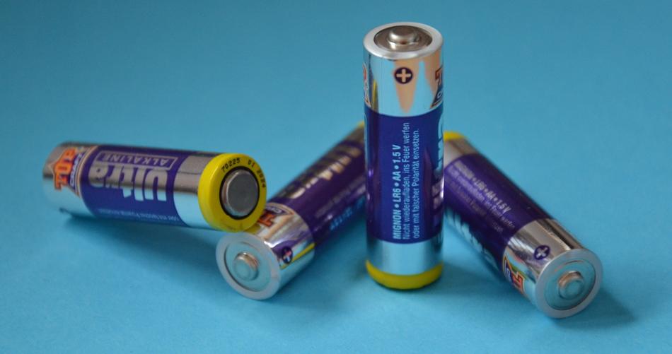 four Rechargeable Batteries at blue background