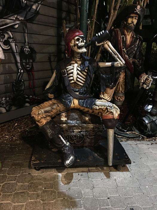 statue of a drinking pirate skeleton