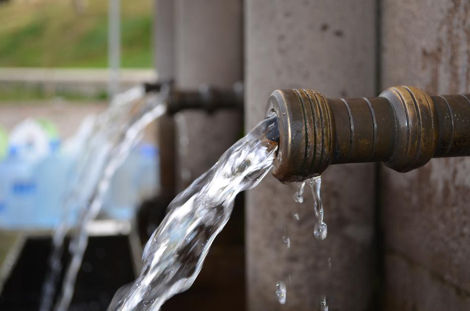 Close-up of the water pipes in the wall