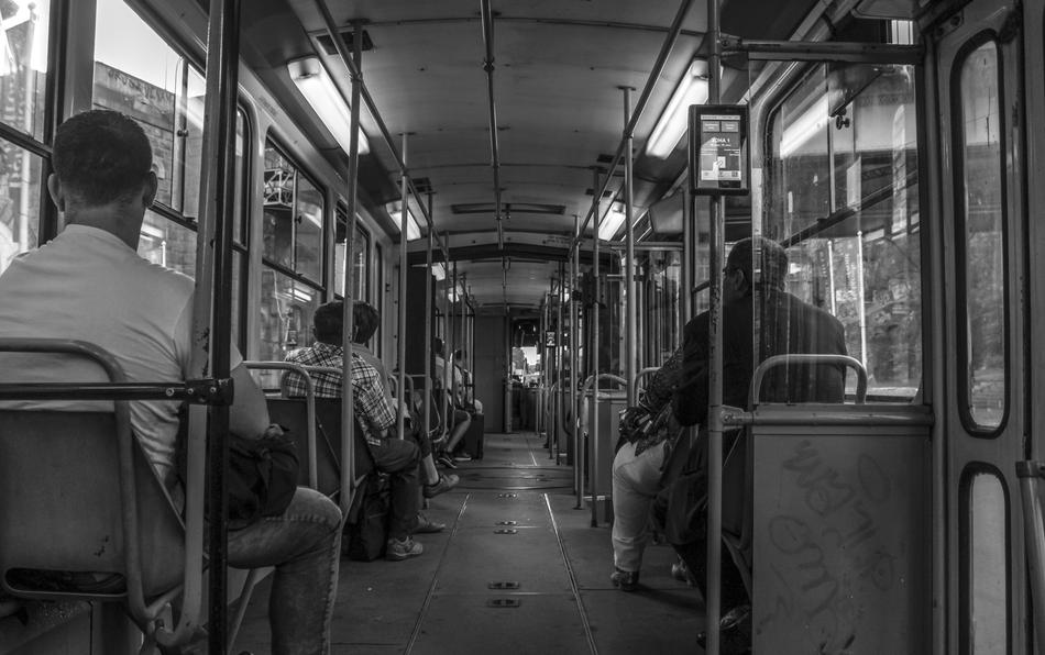 Black and white photo from inside the tram with people in Belgrade, Serbia