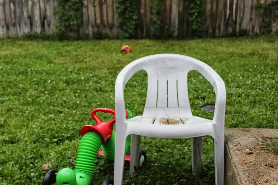 Toys Chair on Fenced Backyard