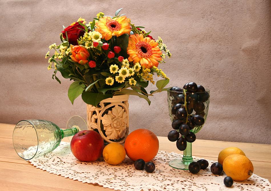 fruit next to bouquet of flowers