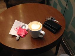 coffee and a purse on the table