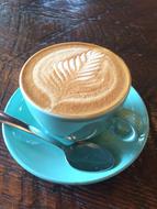 foam latte with leaf pattern